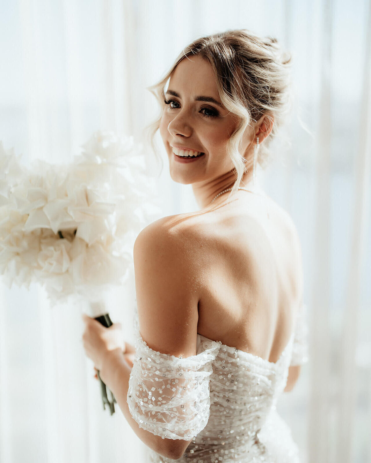Bride smiling in her wedding dress