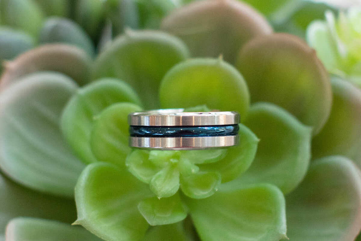 groom's ring detail on succulent at Hayes Hollow at Hidden Falls wedding in Spring Branch Texas