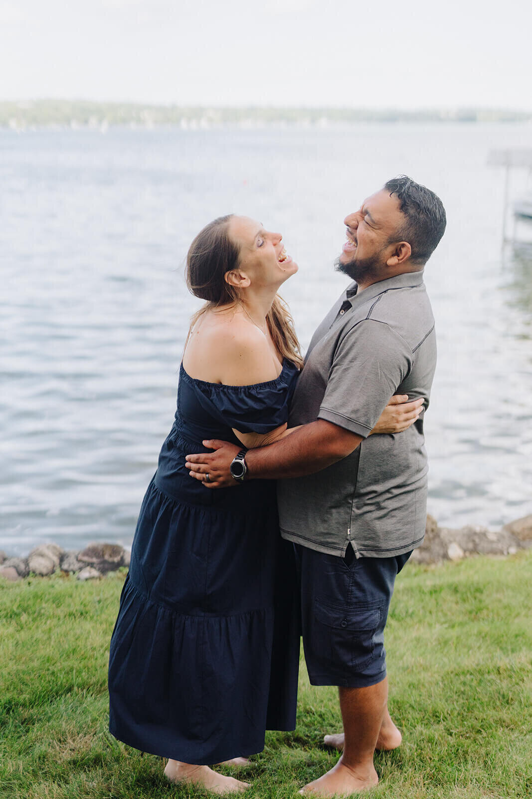 couple laughing and hugging at generational photoshoot in Finger Lakes, NY