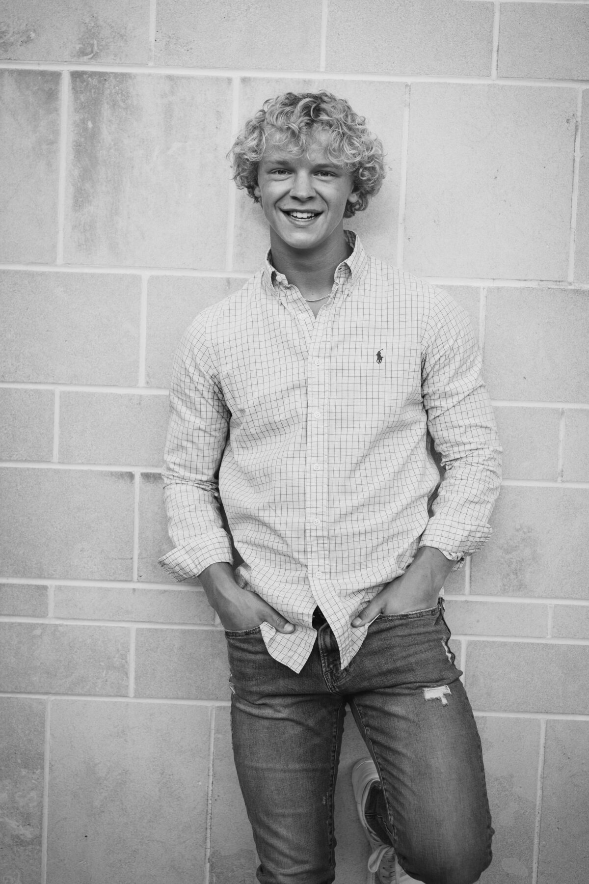 Canal Winchester senior, Ryan hawk, smiles and leans up against Jeffrey Mansion in Bexley, Ohio.