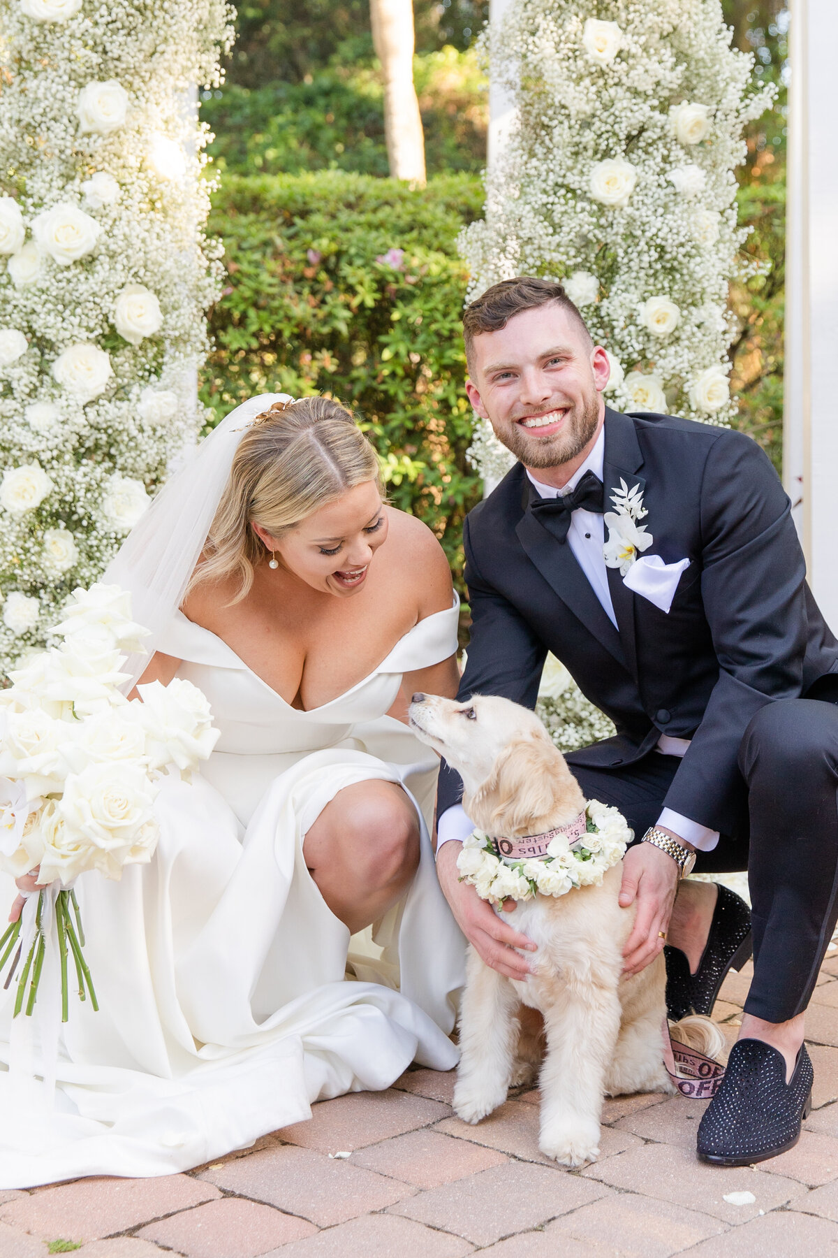 An orlando bride and groom with their dog on their wedding day