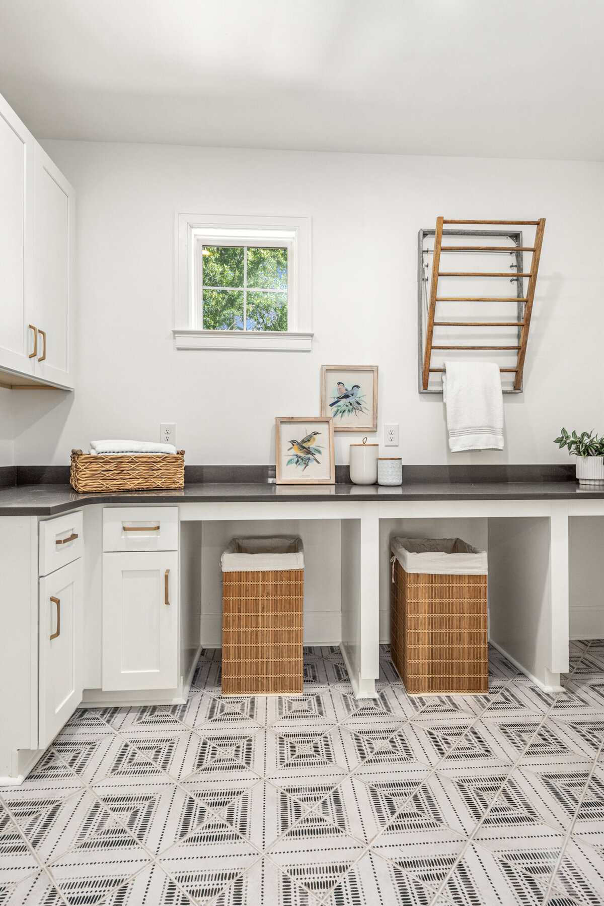laundry room with cabinetry and drying rack