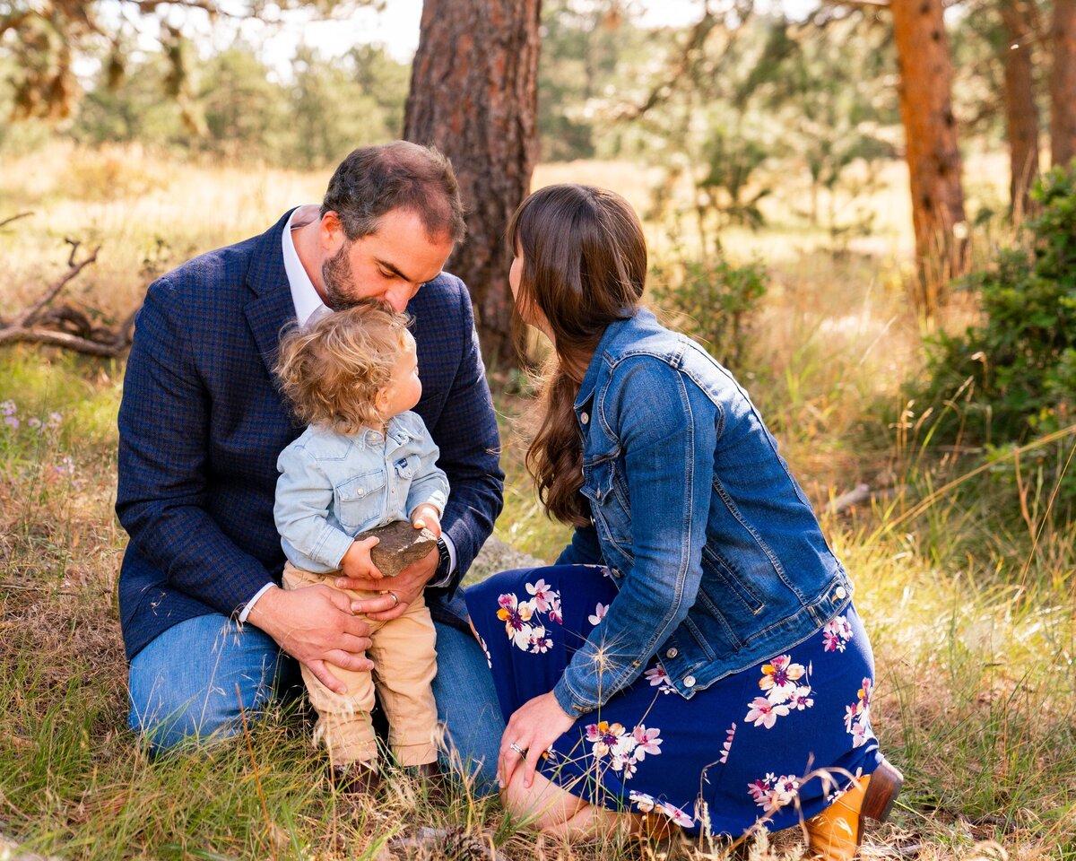 denver family photographer - family sitting in grassy area