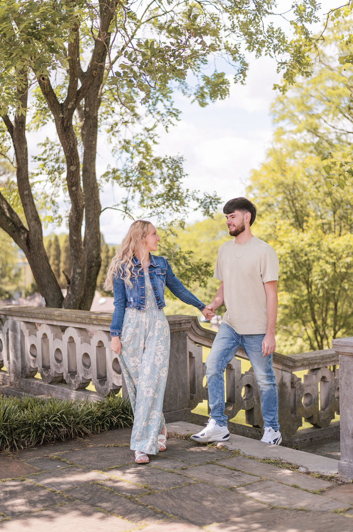 The Workmans walking up the steps together during a relaxed couples session in Pittsburgh — captured by Bree Stewart of Lens Love Photography.