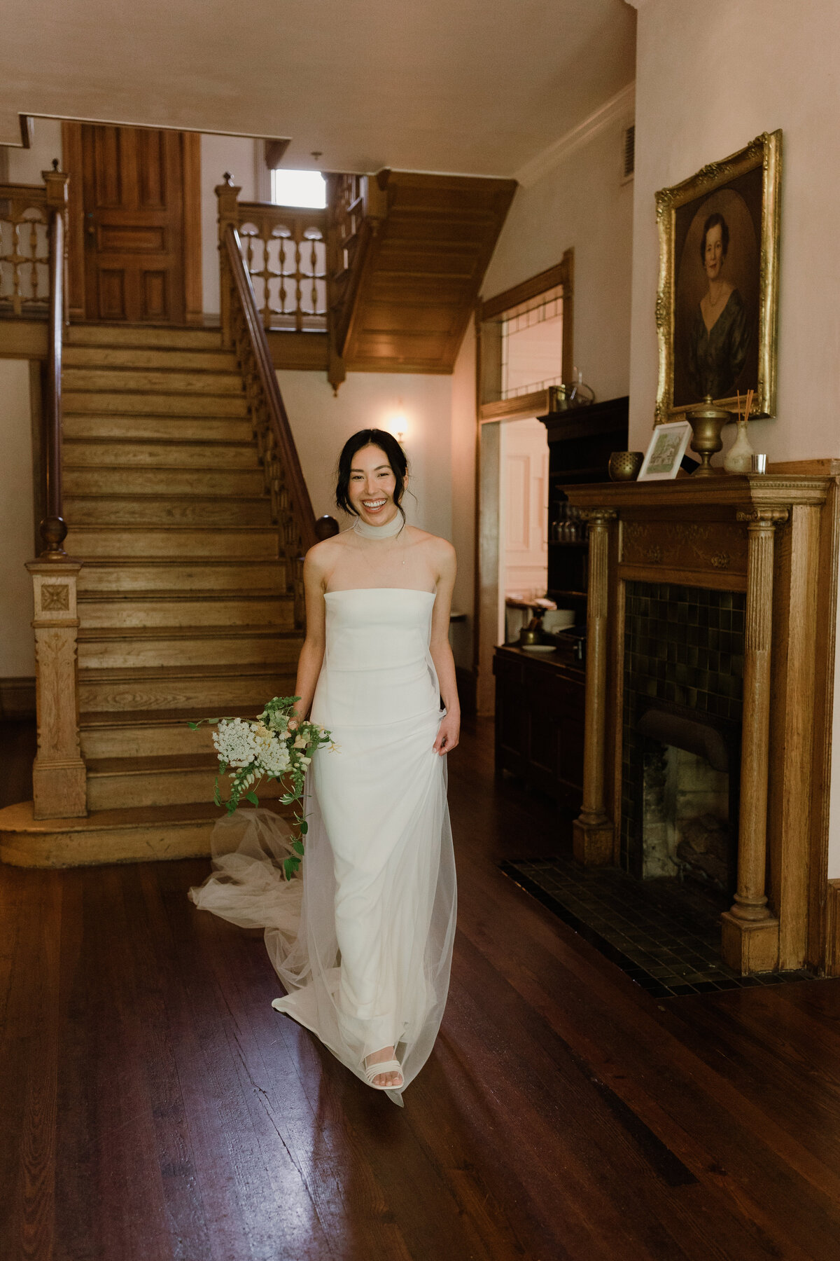Bride standing in front of staircase at Mattie's  Austin Wedding