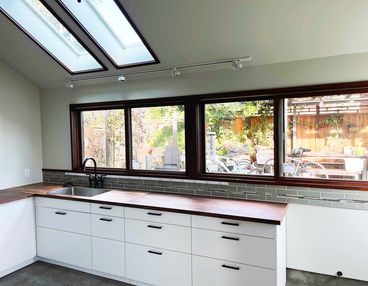 New kitchen with bank of windows along the counter