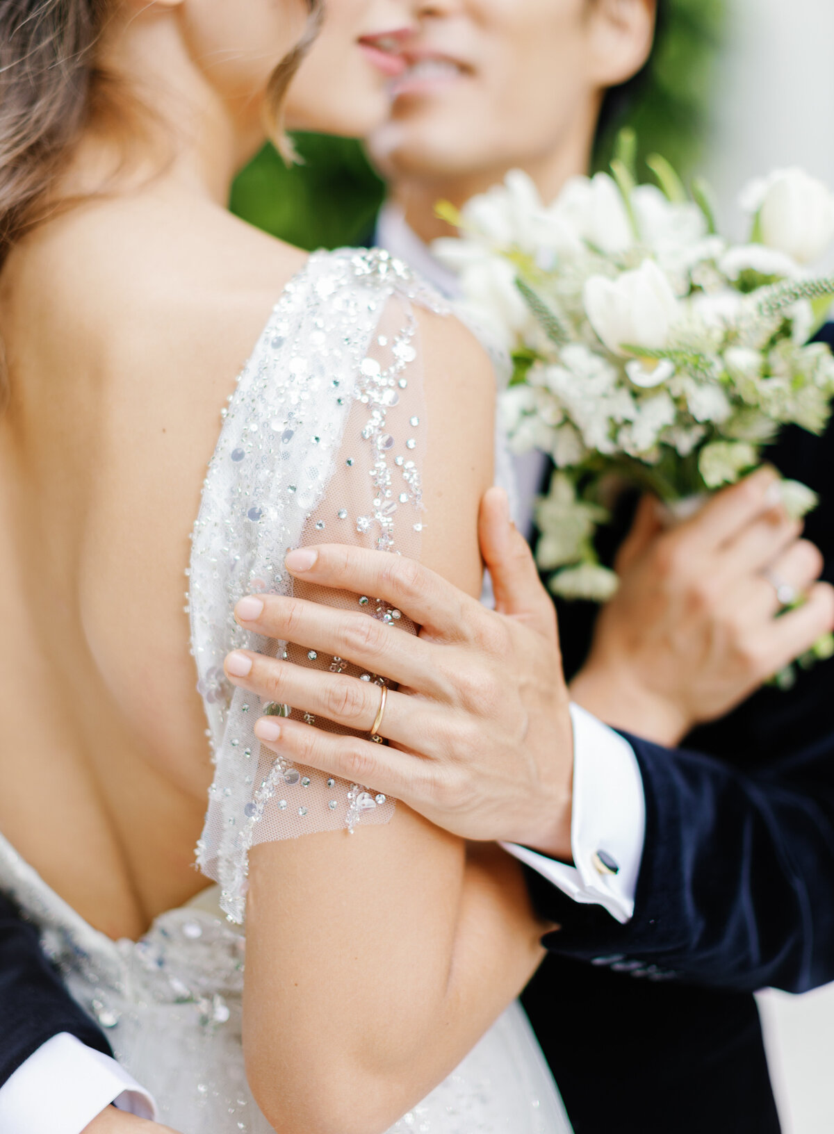 Intimate moment between bride and groom with a focus on the bride's embellished gown, photographed by Claudia Amalia Photography in Miami, Florida.