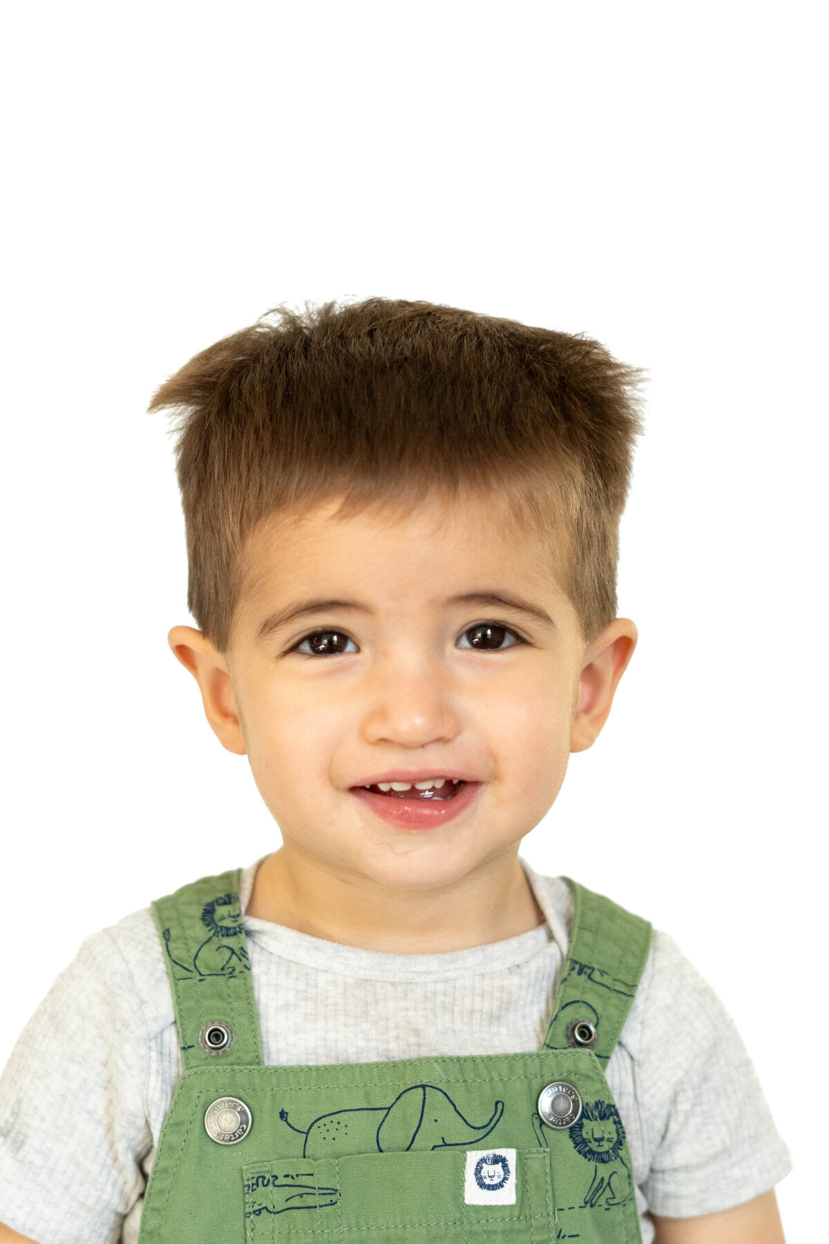 Little boy in overalls in school photo