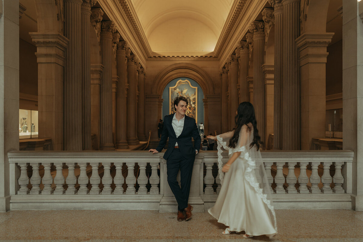 couple posing at the Met before their NY City Hall elopement shot by Elsie Goodman Photography | NYC Elopement Packages