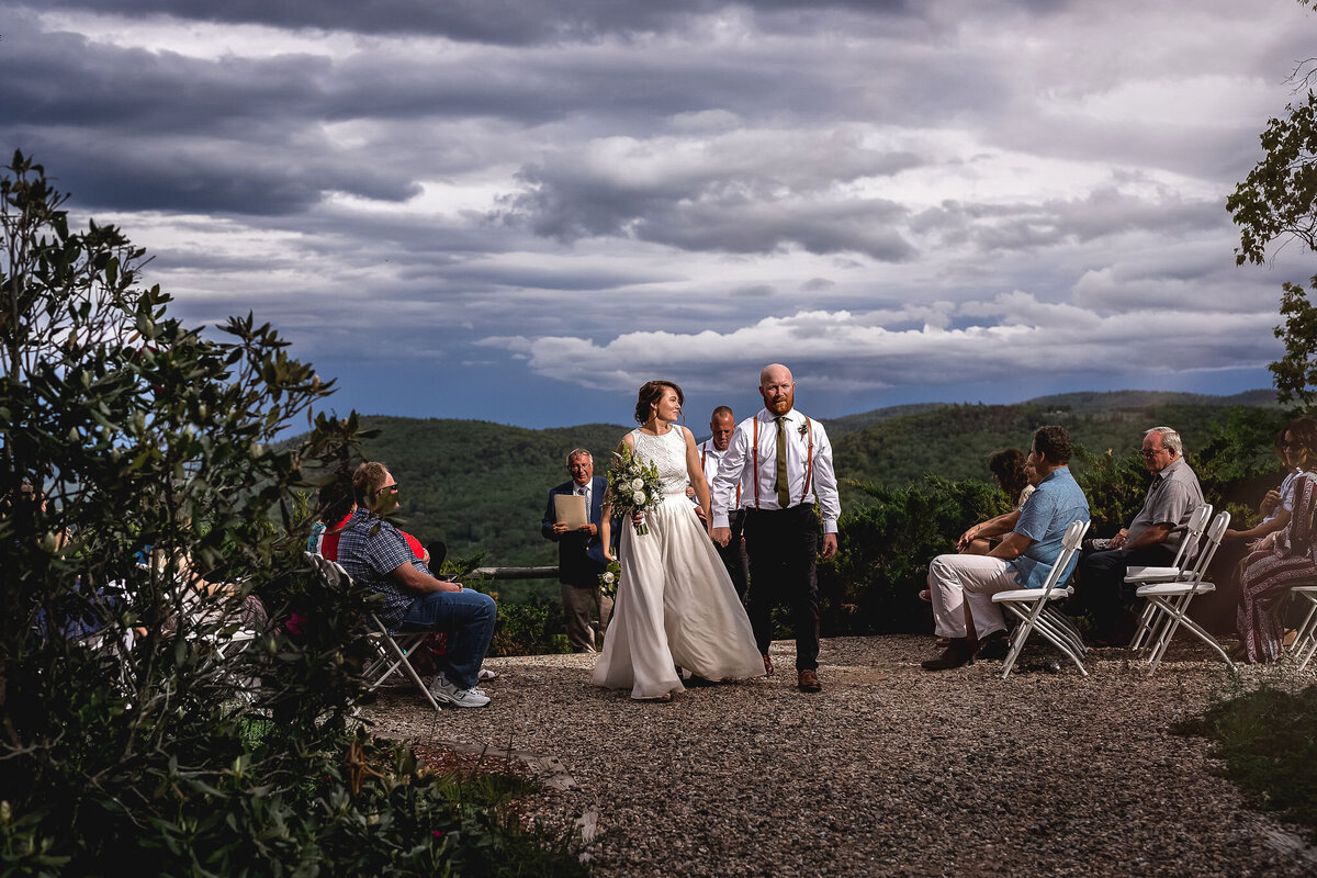 Bride and groom exit in casual mountain top wedding ceremony in Tamworth NH by Lisa Smith Photography