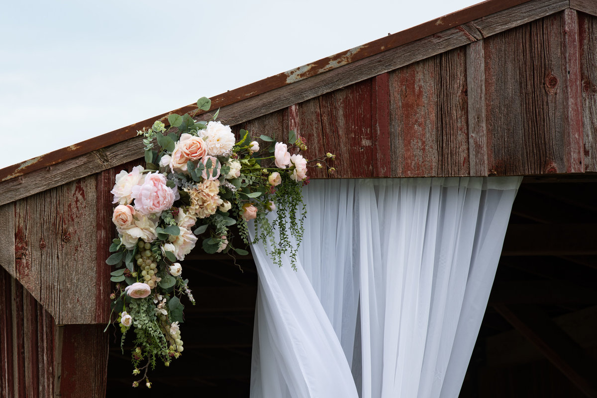 barn flowers and curtains in corner