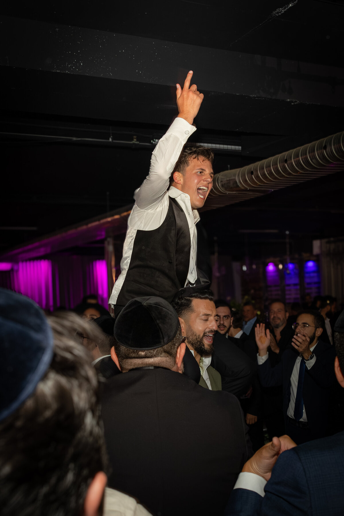 Groom dancing with family and friends at wedding Montreal