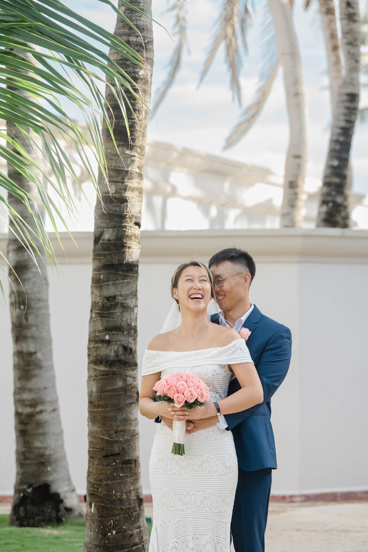 a laughing bride and groom in Cancun