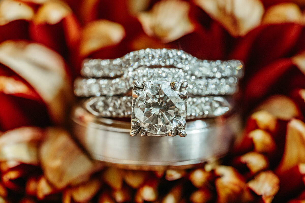 Bride’s rings and jewelry on textured fabric