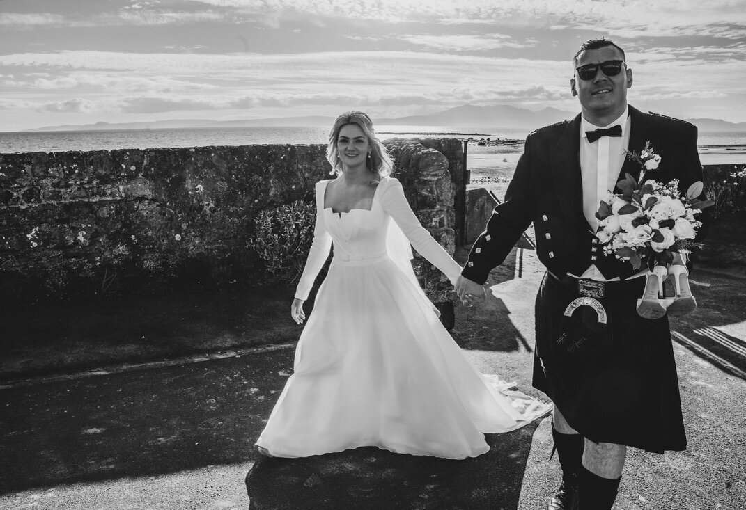 Bride and groom on wedding dat down seamill beach