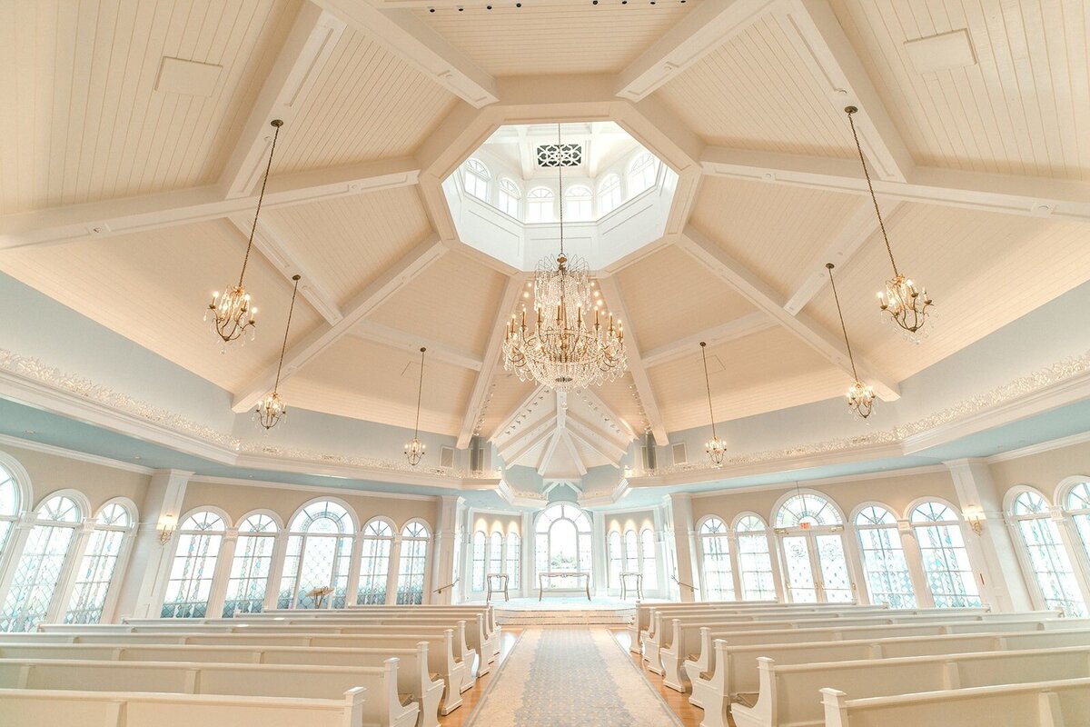 inside the Disney Wedding Pavilion with white and light blue interior