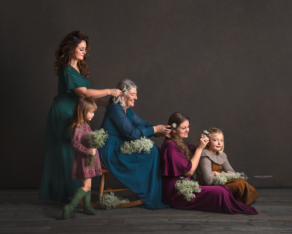 Four generations of women doing each other's hair.