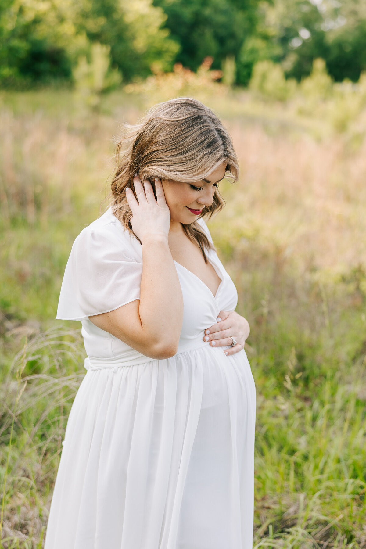 Maternity session of soon-to-be mom  wearing a white Baltic Born gown from my client closet.