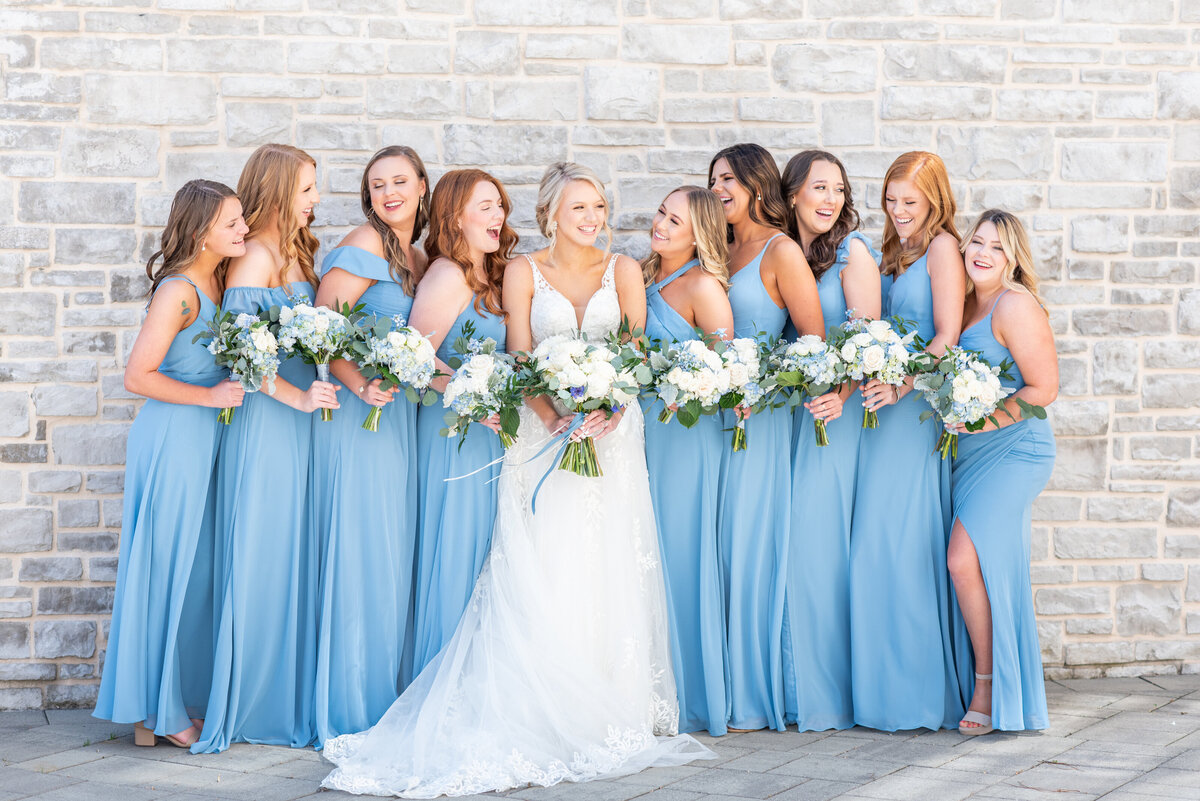 bride laughing with bridesmaids