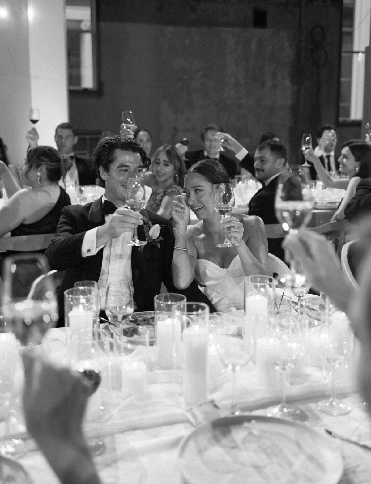 an emotional bride listens to speeches at a Detroit State Savings Bank wedding reception
