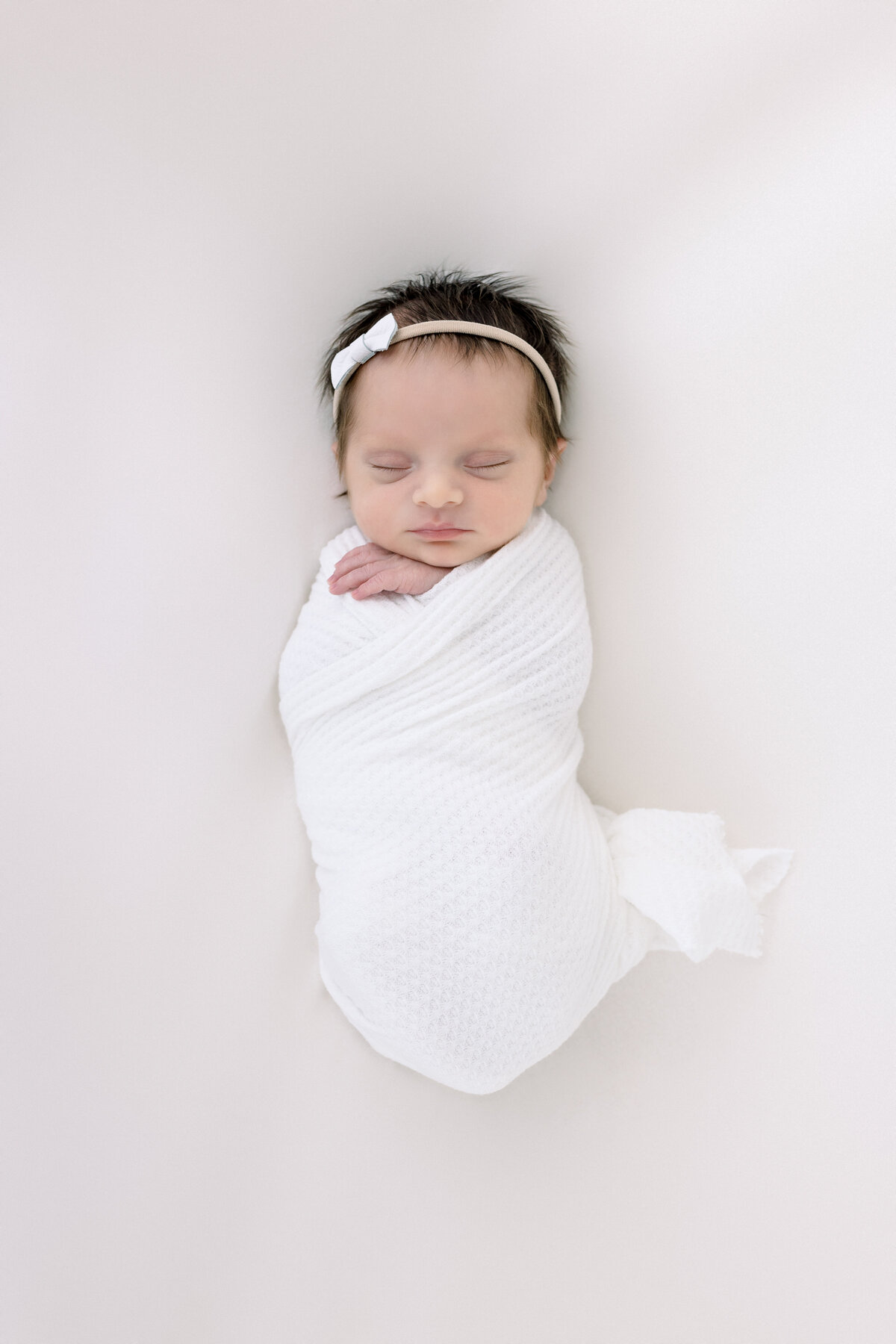 Jaclyn Castellanos offers a client closet for her Newborn Sessions