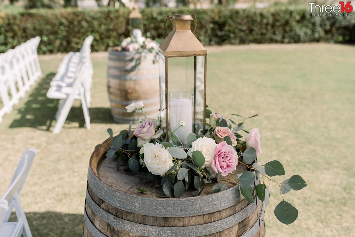 Wine Barrel decor with flowers and candle on top