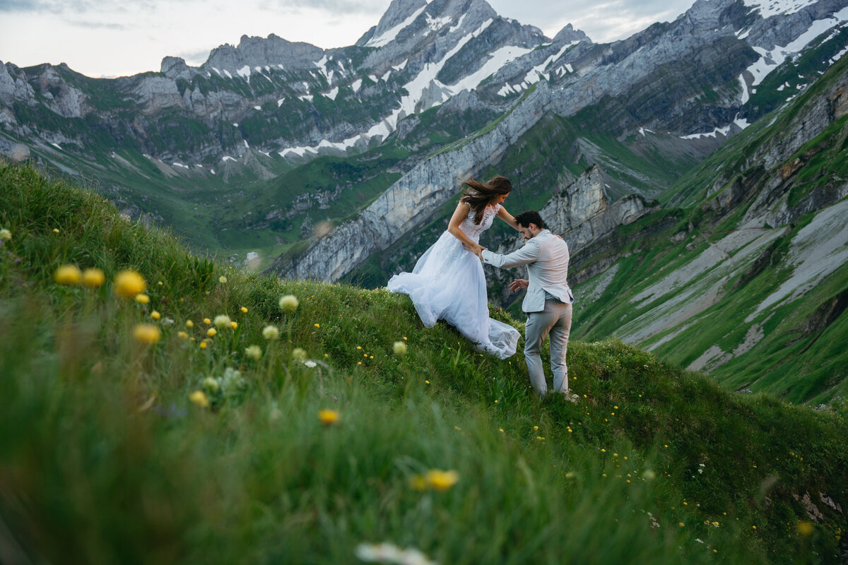 Wildflowers and eloping couple in Switzerland