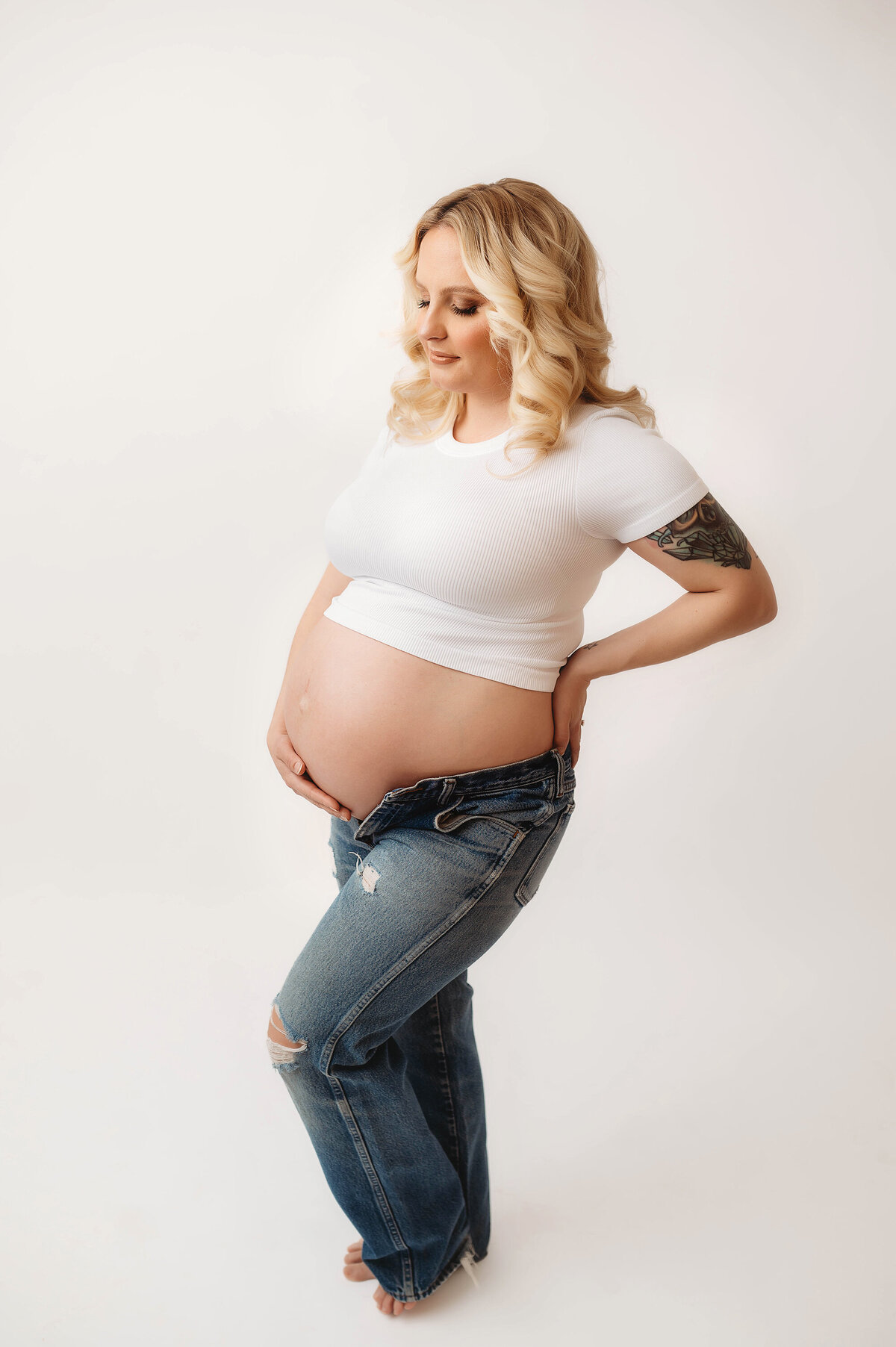 Pregnant woman poses for Studio Maternity Photos in Asheville, NC Maternity Portrait Studio.