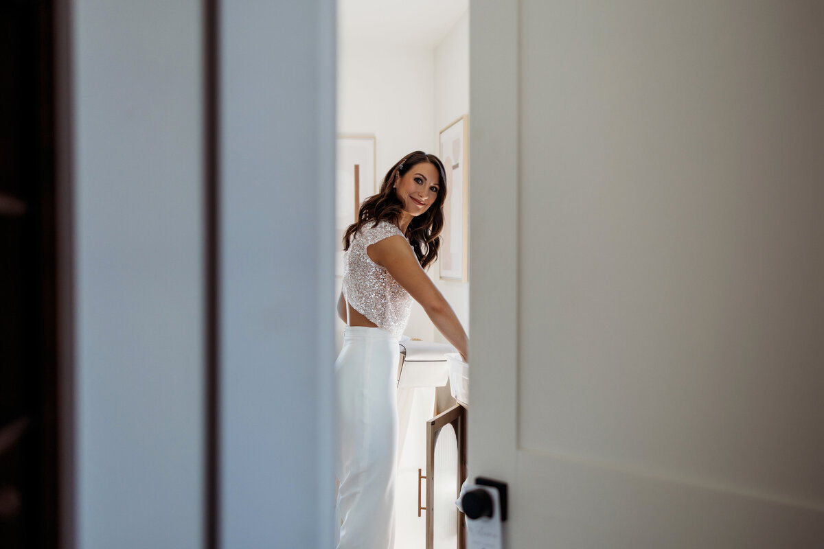 Bride getting ready to leave for her first look with her husband at Surf Hotel