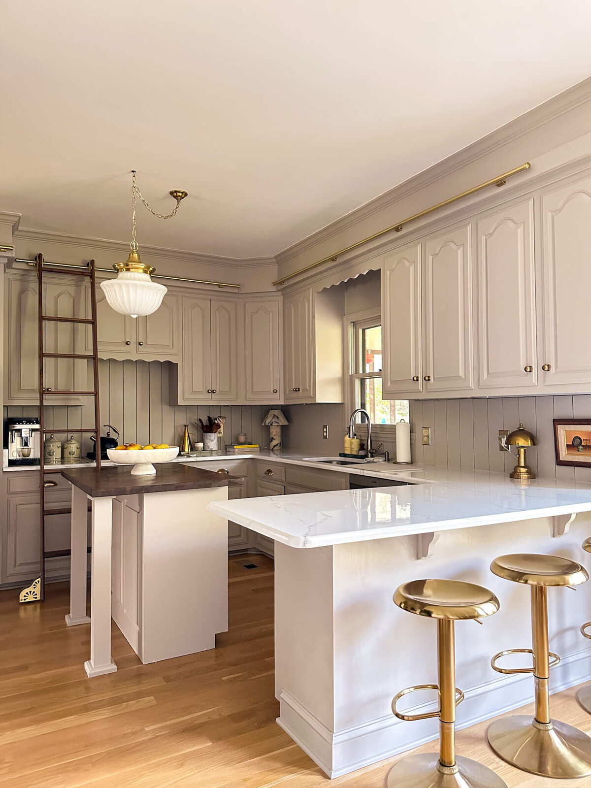 budget-friendly-kitchen-renovation-warm-taupe-marble-library-ladder
