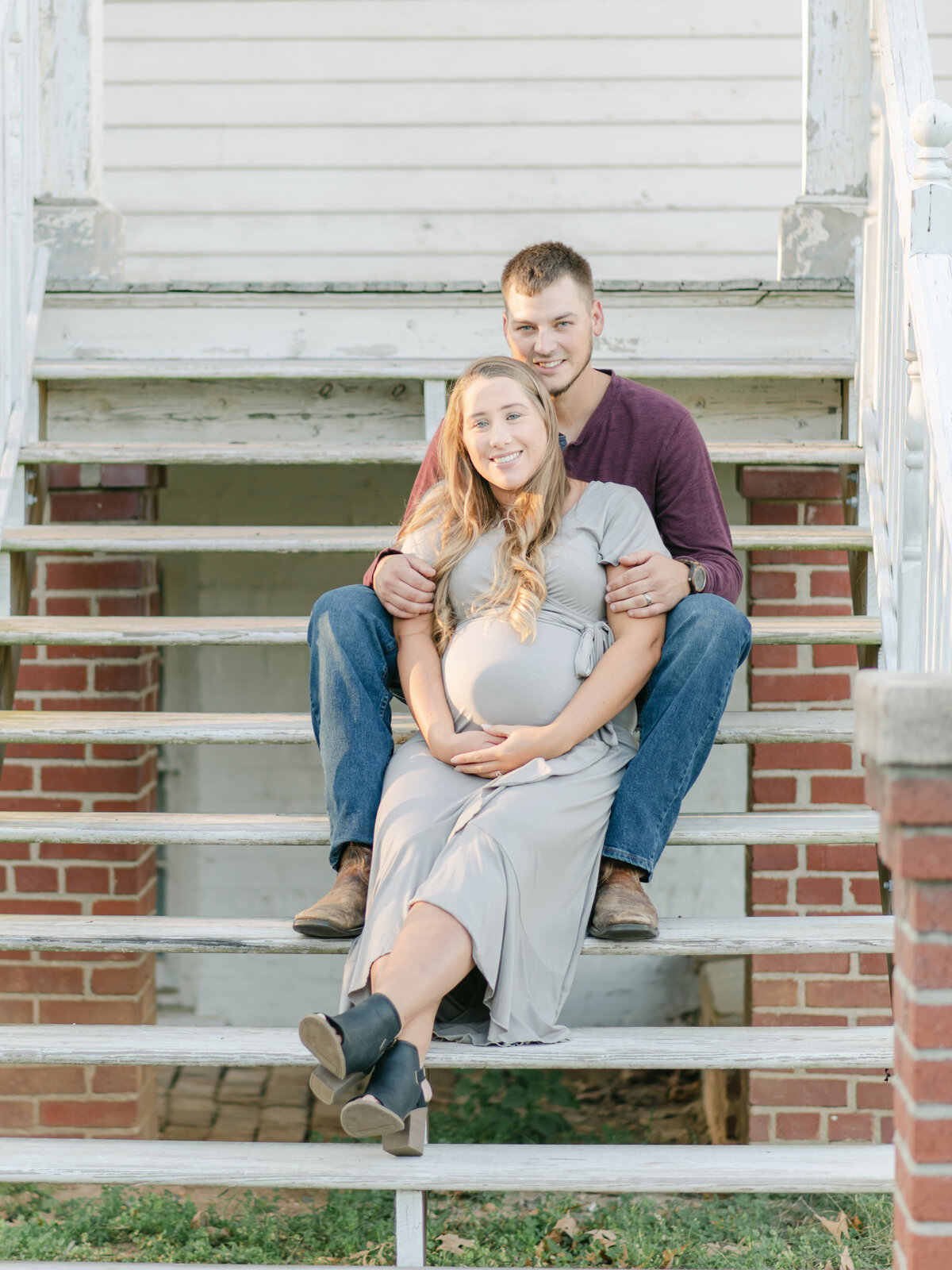 Young couple expecting their first baby on historic Richmond home.