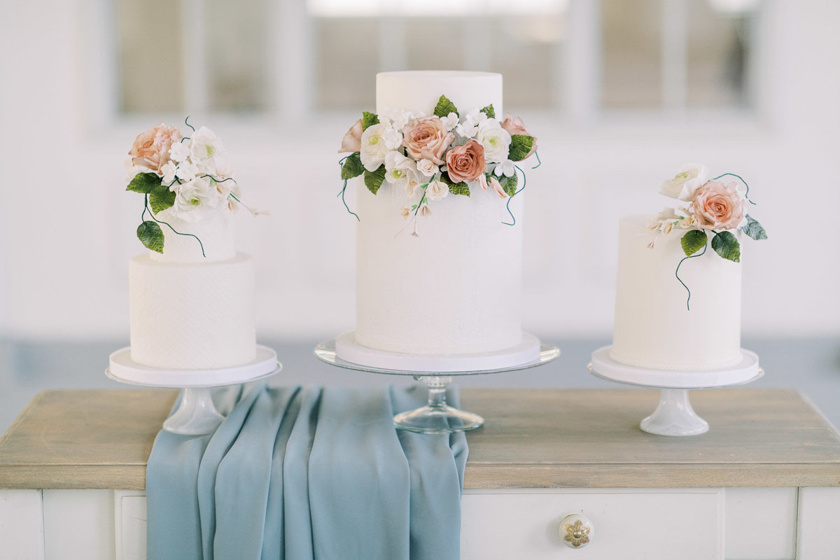 white fondant wedding cakes with sugar flowers