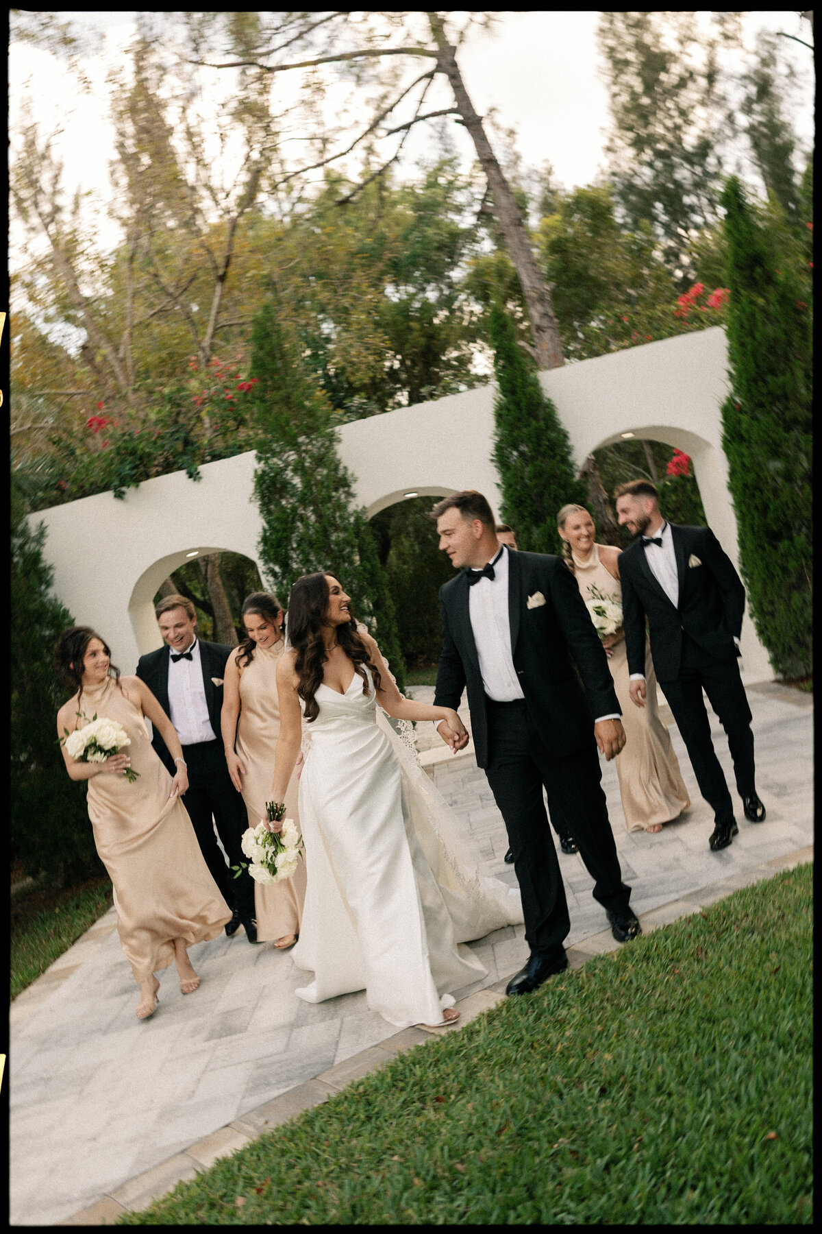 Bridal party portraits with Tuscan-style backdrop at La Casa Toscana