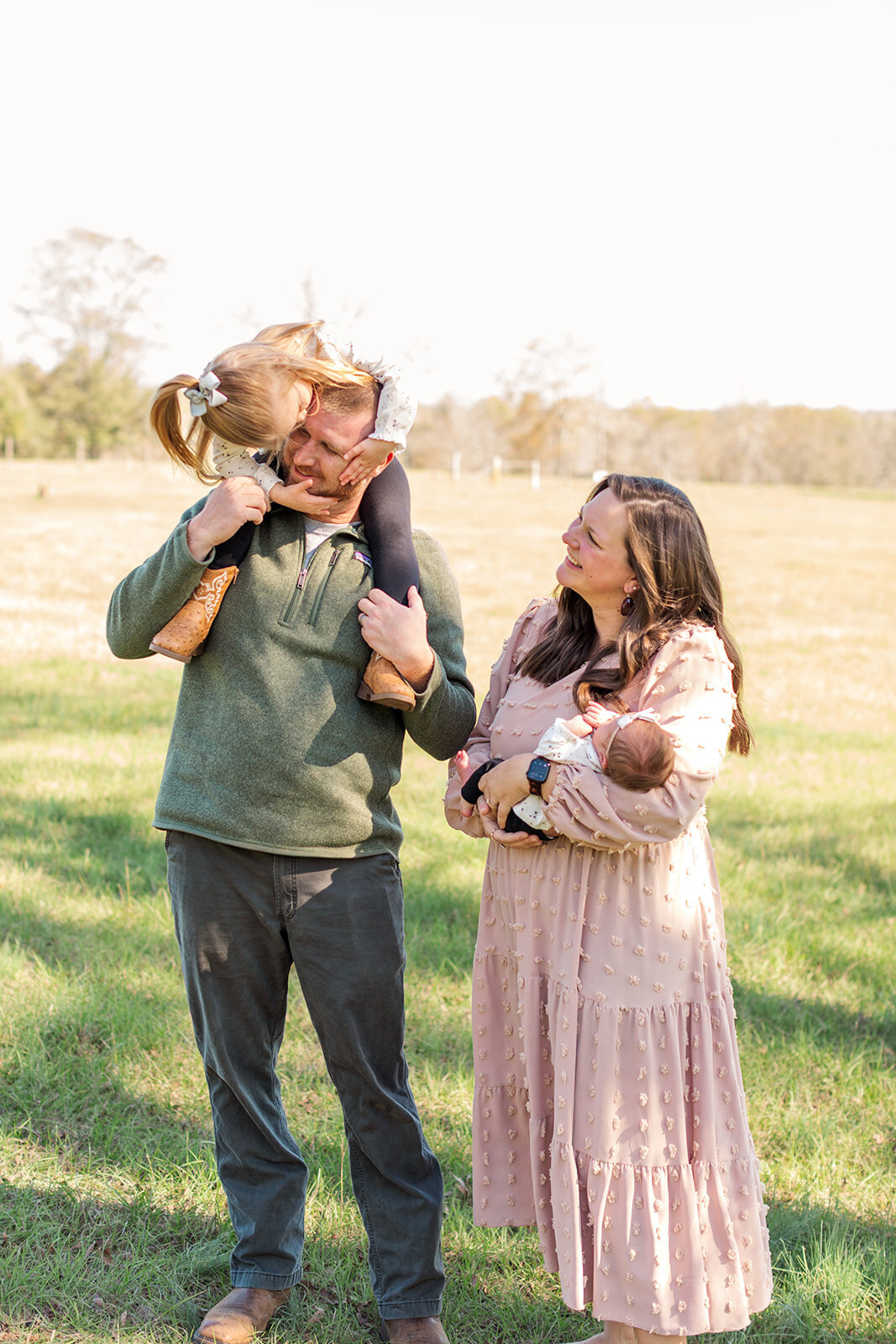 Candid newborn and sibling moments photographed at home
