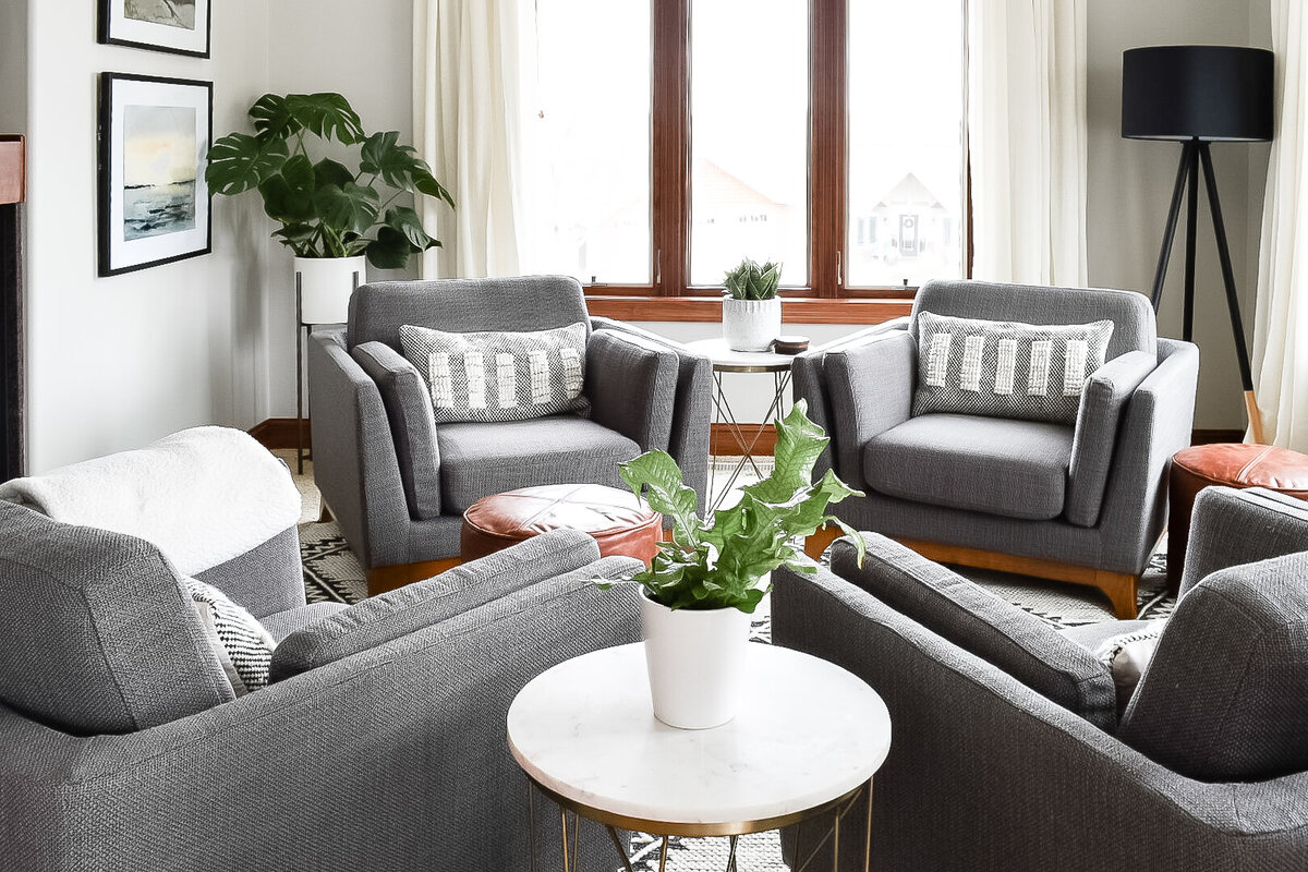 4 grey chairs in a home seating area