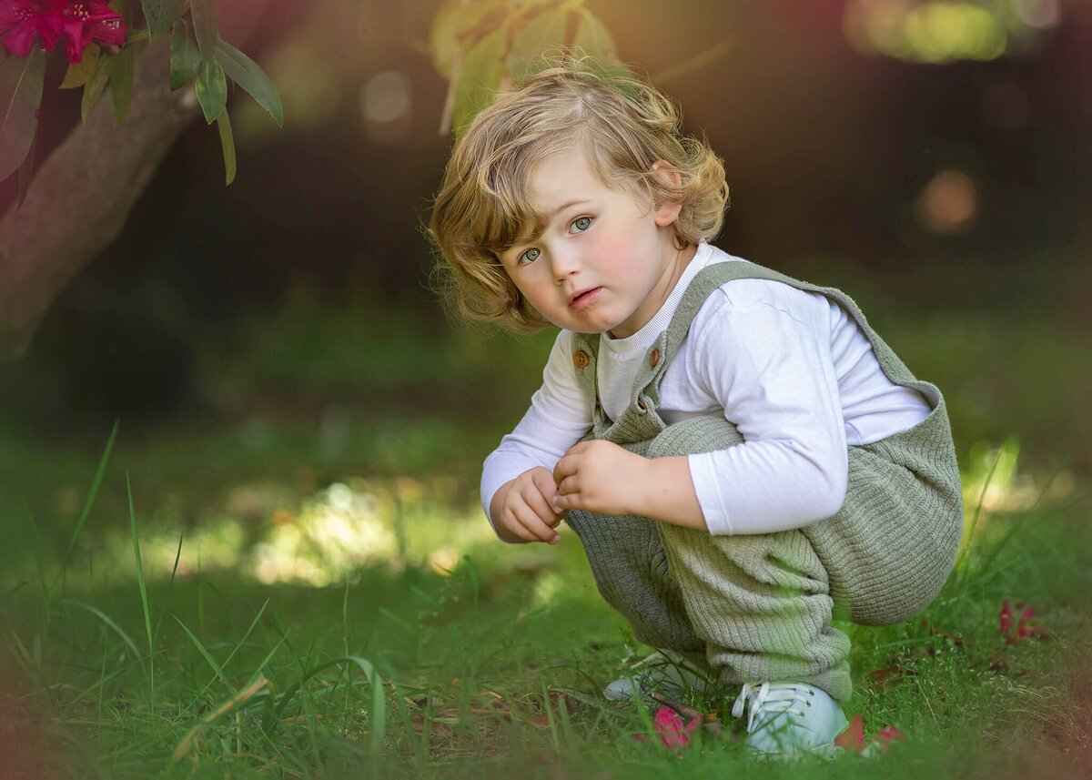 Little boy playing in the grass at the park wearing Zara romper - Los Angeles Children’s Photographer