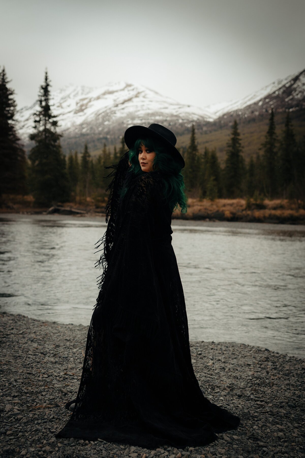 A non-traditional bride elopes in a black wedding gown in Eagle River, Alaska