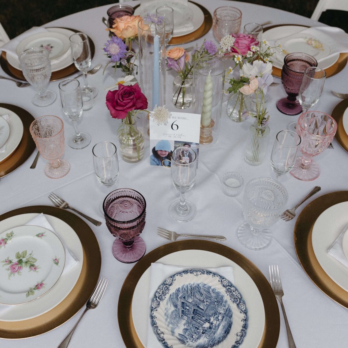 Table setting with antique china and bud vase floral arrangements by Flowers and Thyme.