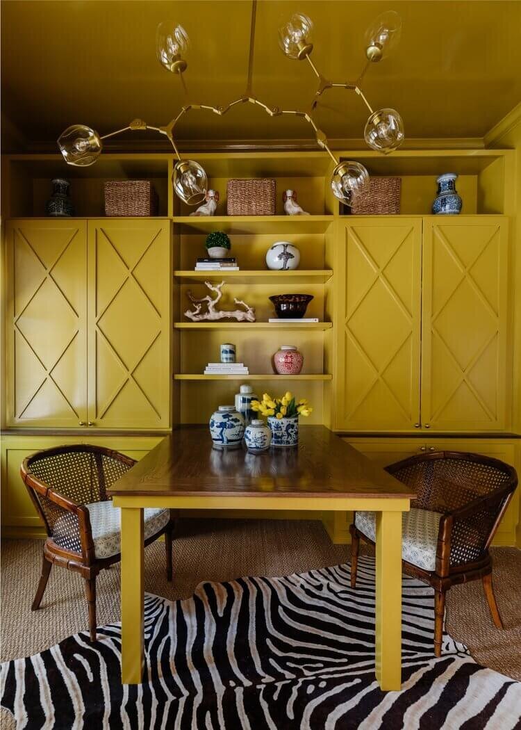 oyster creek studios home on the range wooden chairs around a yellow dining room table with yellow shelving