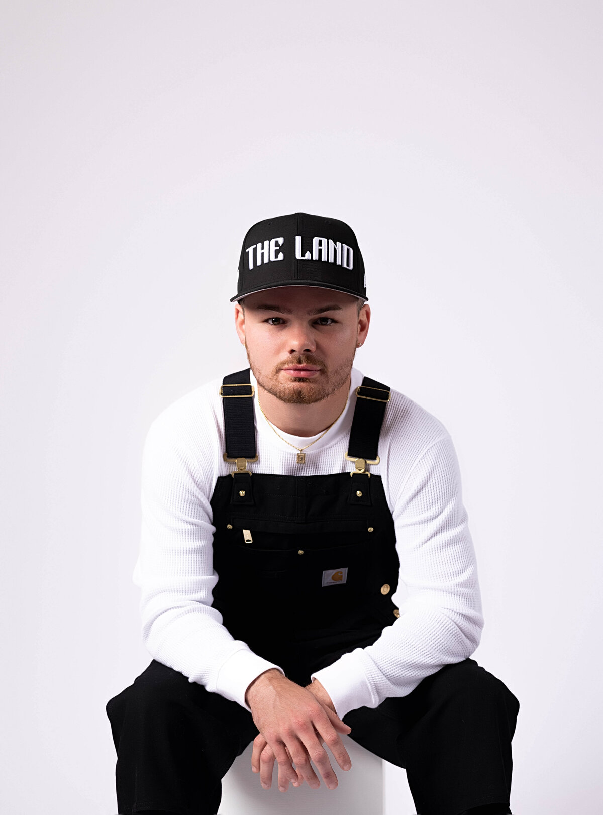 Professional boxer sitting on a box in birthday session with Reva Davis photography