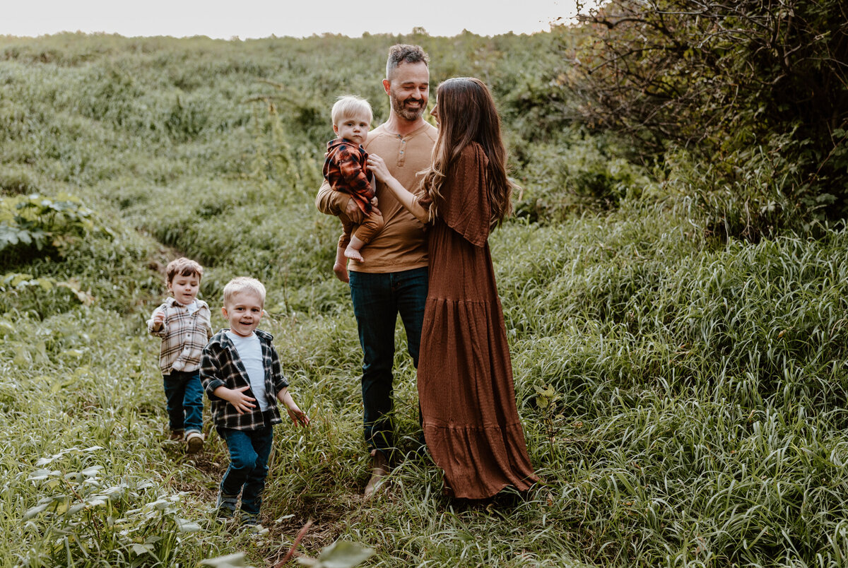 Dad smiling at mom with kids