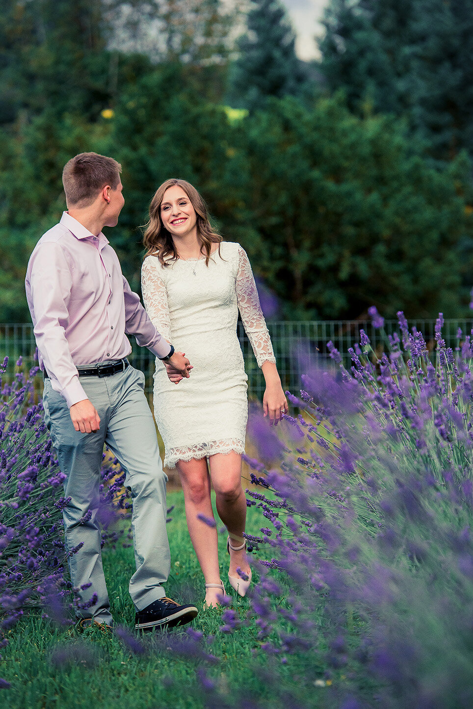 couple walking in lavender field