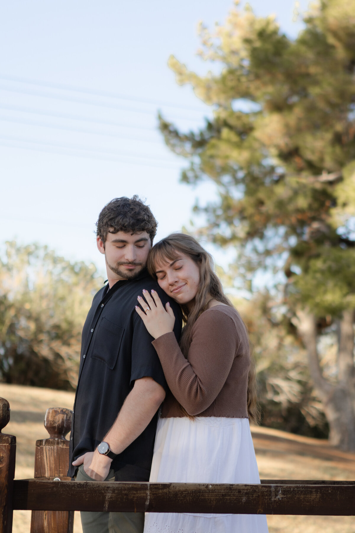 Jovanna G Photography. Classic, sophisticated Wedding Photos. Soft romantic engagement photos. Soft romantic WeddingPhotos. Sophisticated Wedding Photographer. Professional Wedding Photographer. Destination Wedding Photographer. Luxury Wedding photographer. Traveling Wedding Photographer. AZ Wedding Photographer. Gilbert AZ Wedding Photographer. Queen Creek Wedding Photographer. Phoenix Wedding Photographer. Scottsdale Wedding Photographer. Flagstaff Wedding Photographer. SoCal Wedding Photographer. California Wedding Photographer. Northern California Wedding Photographer. Southern California Wedding Photographer. San Francisco Wedding Photographer. Bay Area Wedding Photographer. San Jose Wedding Photographer. Golden Gate Bridge Wedding Photographer. Beach Lover Wedding Photographer. Palace of the Fine Arts Wedding Photographer. Ocean Lover. I love California. Orange County Wedding Photographer. Newport Beach Couples Photographer. Newport Beach Wedding Photographer. Laguna Beach Couples Beach Engagement Photographer. Laguna Beach wedding beach photographer. Los Angeles Wedding Photographer. Young and in love engaged couples who live in southern California. Christian Young Couple. Young Engaged Couple. Engaged High School Christian Couple. Christian Values. Young conservative Christian women. Young Conservative Christian men. Young Conservative Christian Couple. Young Christian Couple Engaged in High School. Young Christian College Couple. Lakeside Lovers in the Autumn Sun. David & Grace - engagement photos. Jovanna G Photographer Engagement Photos. Arizona sun shining through autumn trees- engagement. Chandler, AZ Engagement Photos. Chandler, AZ 2026 bride. Chandler, AZ Wedding Photographer. Chandler, AZ Young Engaged Couple. Girl in her 20s. Engaged Arizona Girl in her 20s. Lakeside Engagement photos. AZ Lakeside Engagement Photos. AZ Weeping Willow Lakeside Proposal. Arizona Lakeside Proposal with weeping willow tree. Detail shot of engagement ring on Arizona Lakeside estate. Chandler, AZ Lakeside Estate Proposal Outfit Inspiration.