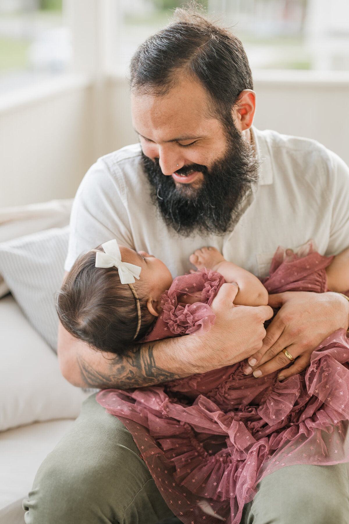 Dad snuggles his little girl during a San Antonio family photography session.