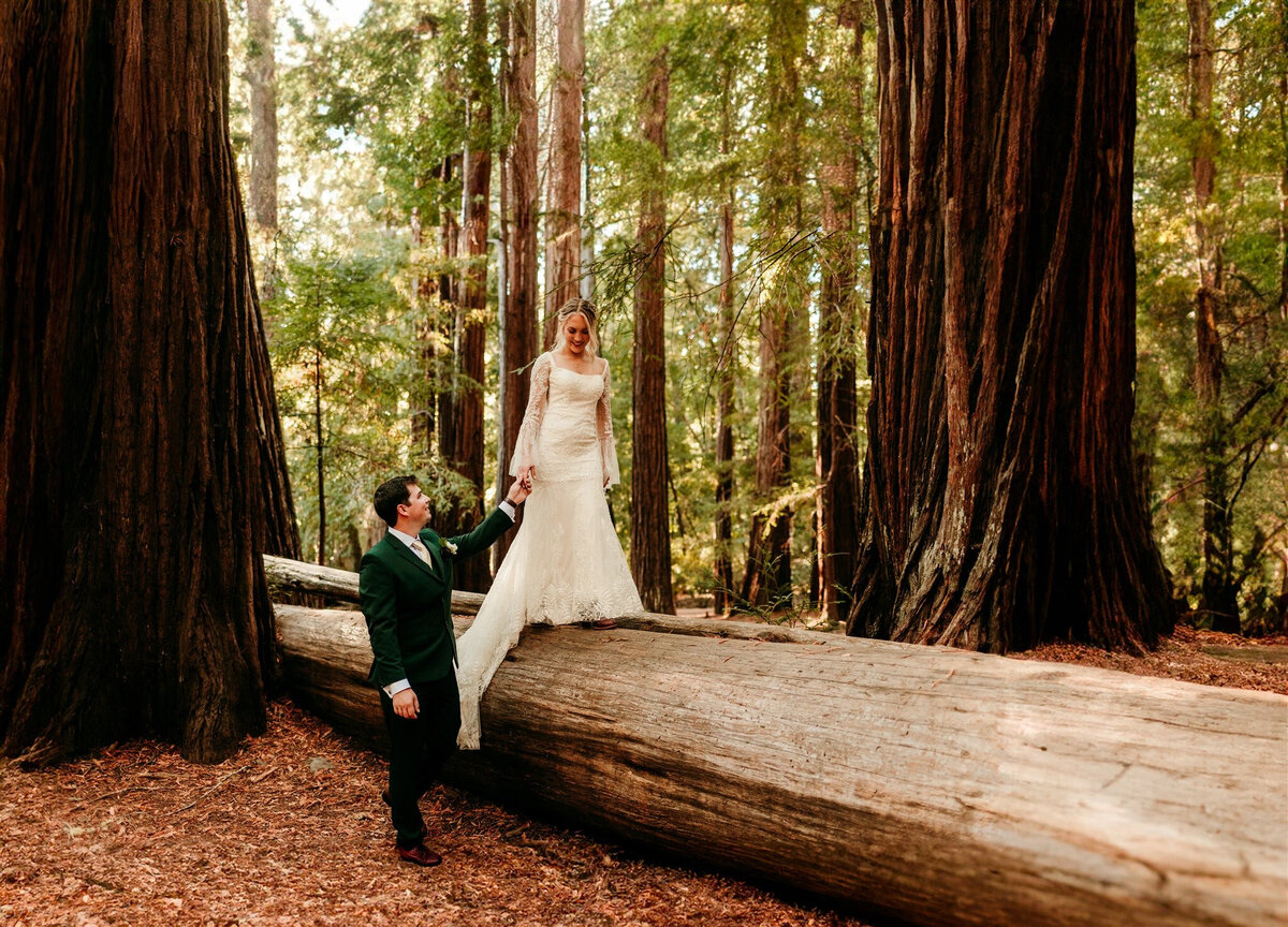 Couple exchanging vows during an intimate redwood forest elopement.
