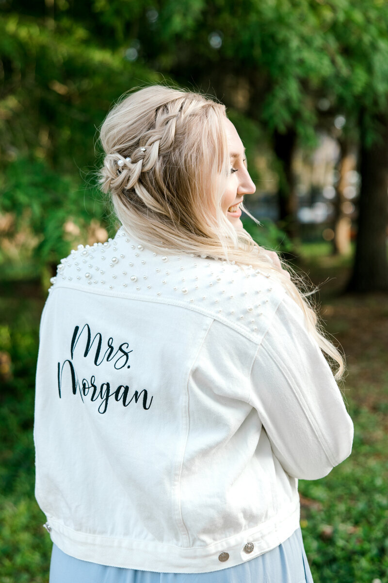 bride wearing custom grooms jacket