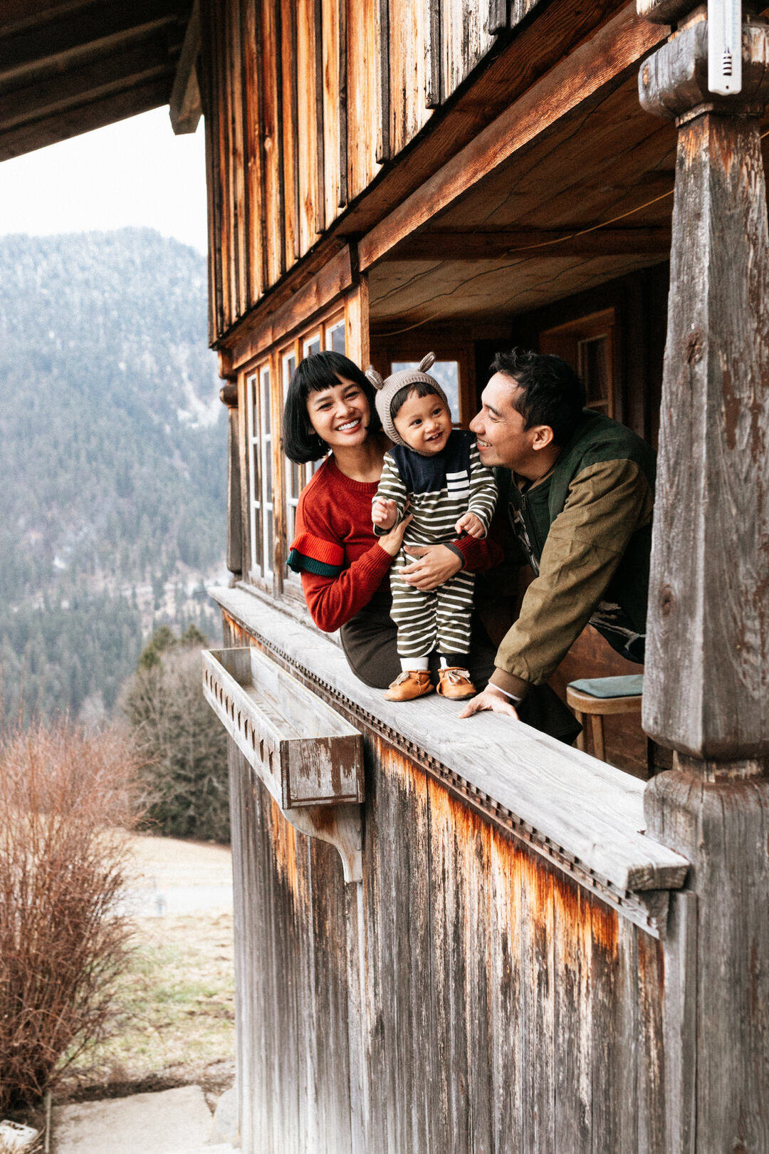 Natural family laughter during outdoor photoshoot in Zurich