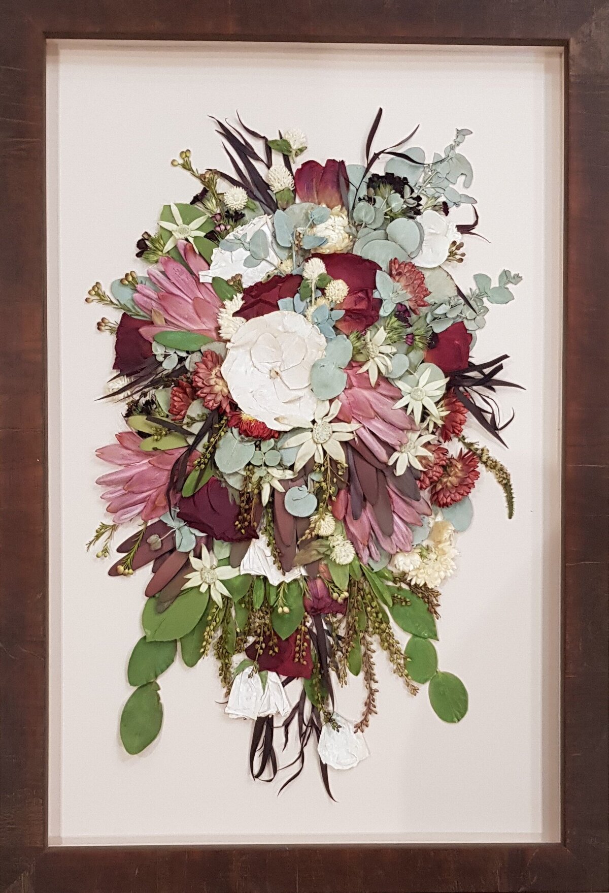 Pressed wedding bouquet in custom frame.