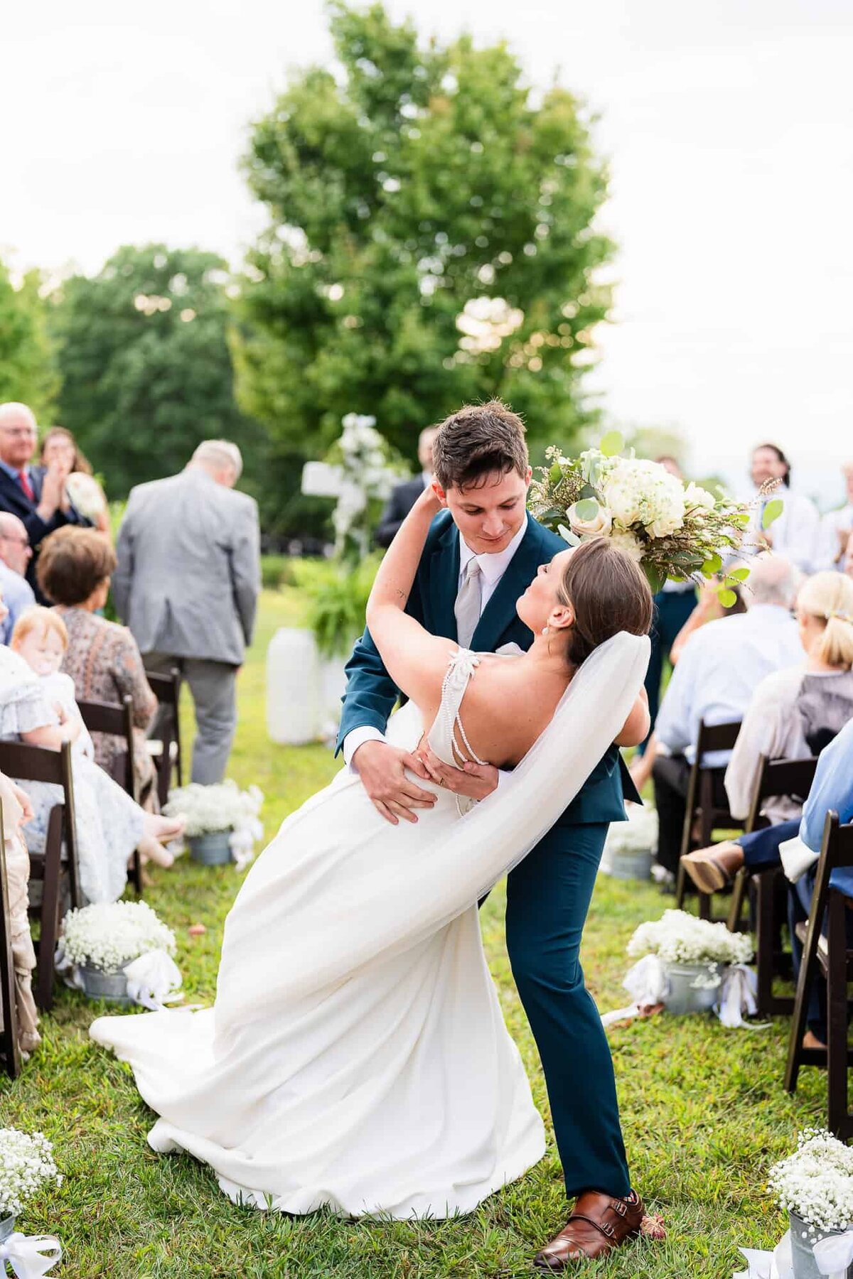 Couple at ever after farms citrus barn wedding