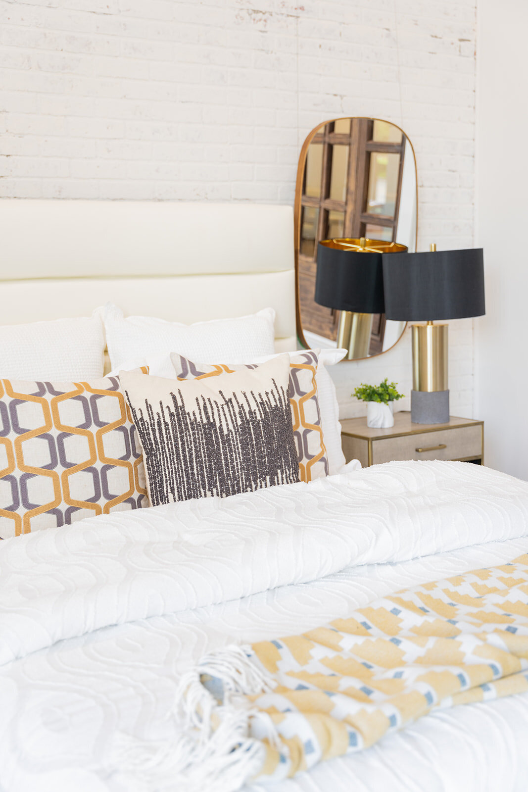 Bedroom with white, black and gold accents